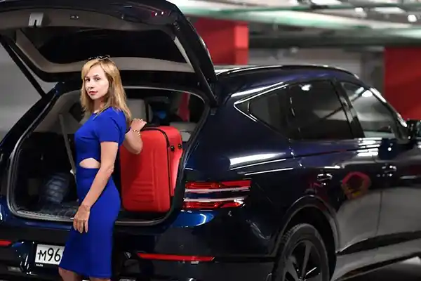 A traveler picking up a rental car at Brisbane Airport