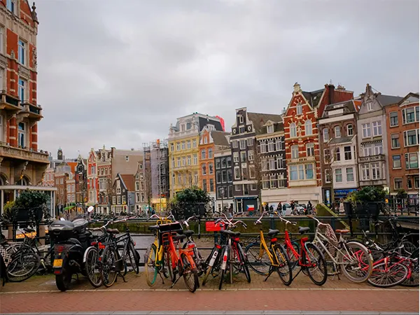 Bicycles With Amsterdam In Background